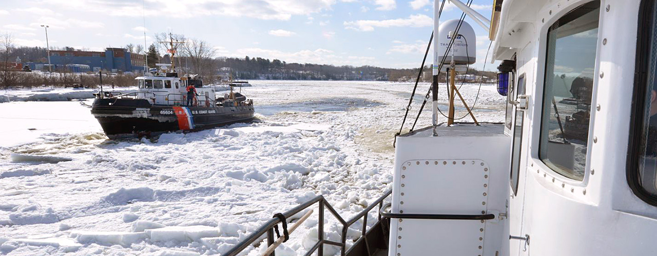 Coast Guard cutters breaking ice on the Penobscot River, Maine.